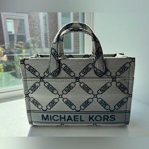 Gray and black Michael Kors handbag